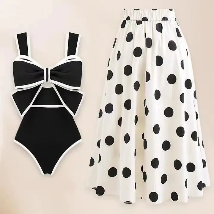 Women's one-piece swimsuit with beach dress style skirt and bow detail in polyester fabric