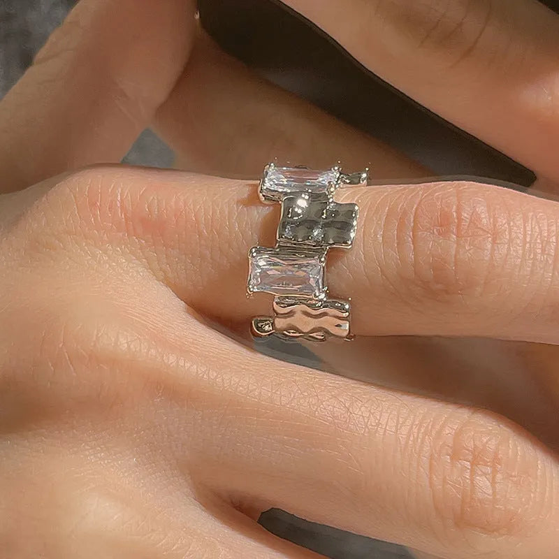 Geometric open ring with zircon stones and silver-plated finish