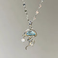 Blue jellyfish charm on sterling silver necklace with adjustable chain