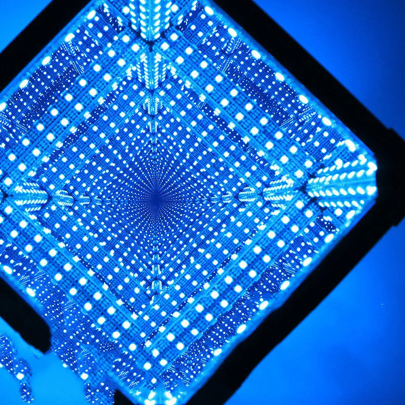 Thousand Mirrors 3D magic cube RGB LED lamp in black with remote control on desk