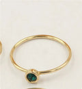 Women's copper knuckle ring with 14K gilding and zircon stones in green, blue, dark red, or white.