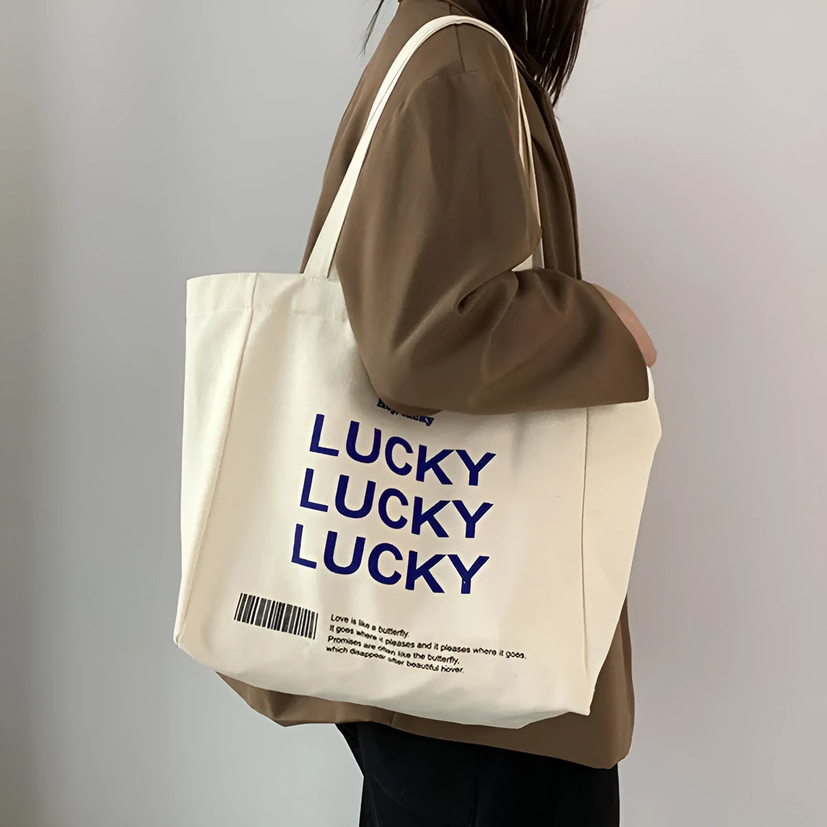 Natural canvas tote bag 32x31.5x10cm with bottom and side panels, small pocket, and metal magnet buckle