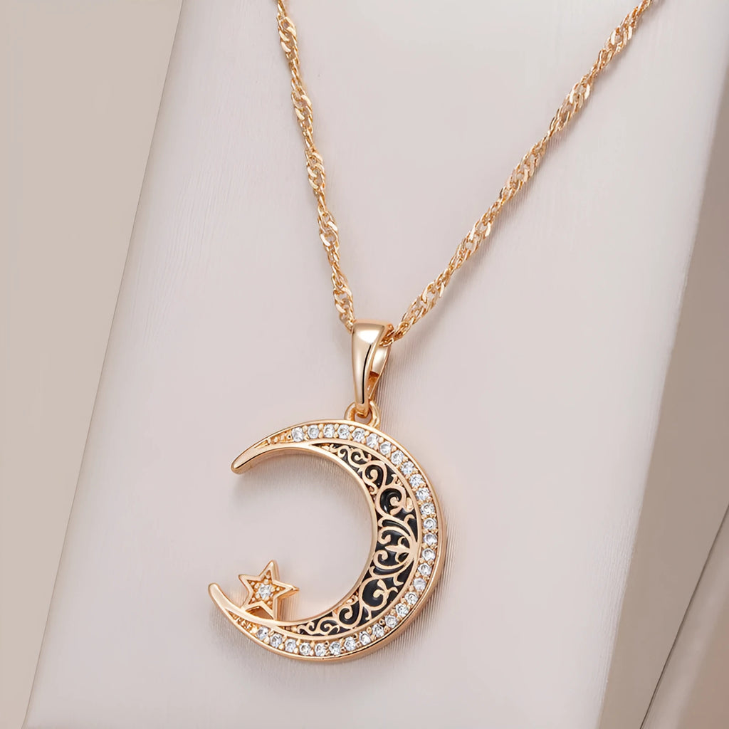 Rose gold coloured necklace with star and moon pendant on water wave chain