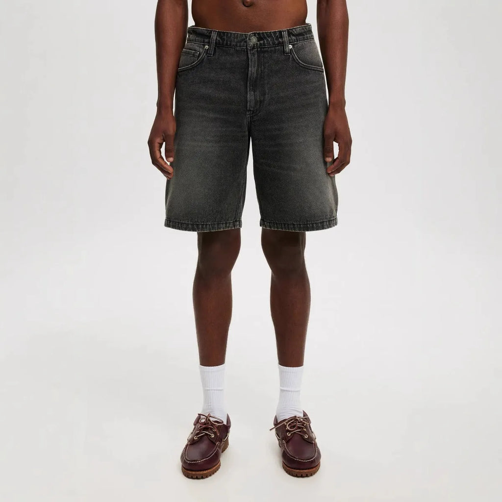 Men's loose fit straight leg jeans in light blue, black, and grey cotton denim