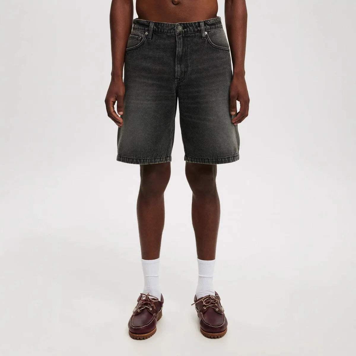 Men's loose fit straight leg jeans in light blue, black, and grey cotton denim