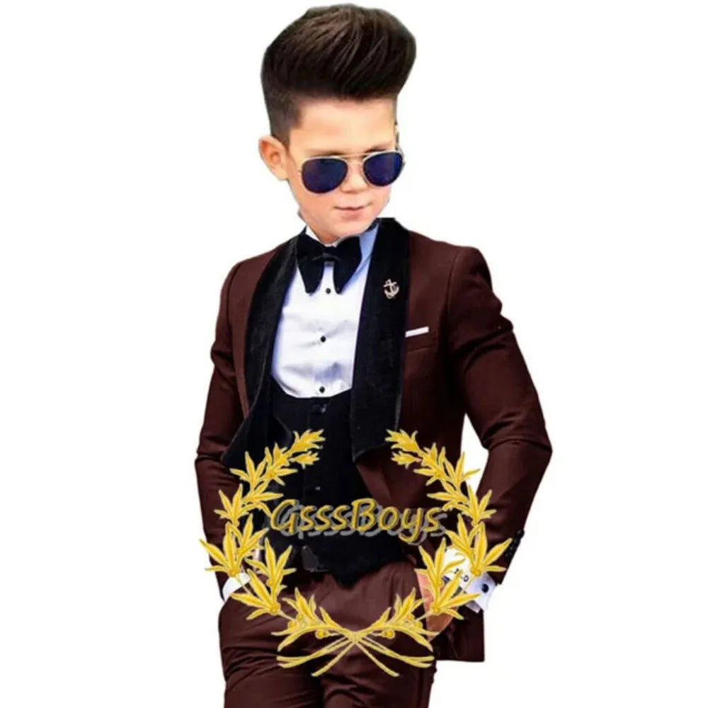 Boys' three-piece suit set in polyester fibre, including jacket, vest, and trousers, available in multiple colours and sizes from 3T to 16T.