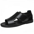 Men's black and brown cowhide leather Roman sandals with open toe and rubber sole.