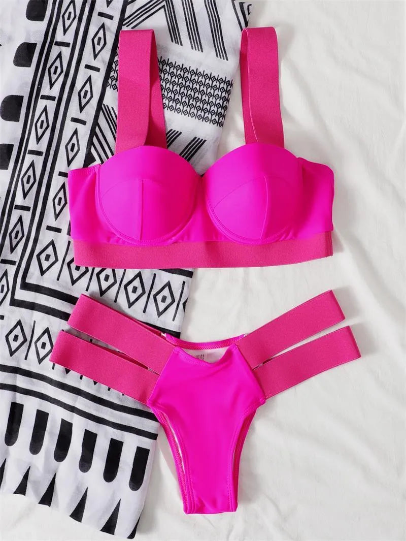Women's rose red bikini swimsuit with steel bracket push-up board, shown with matching pants.
