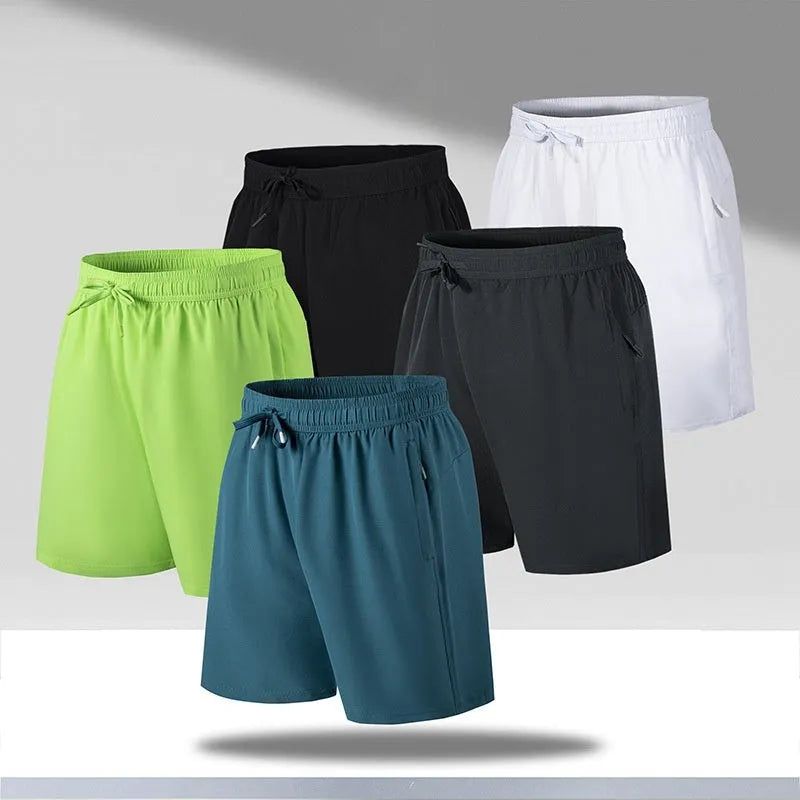 Man wearing loose-fit black quick-dry sports shorts made from polyester ice silk fabric.