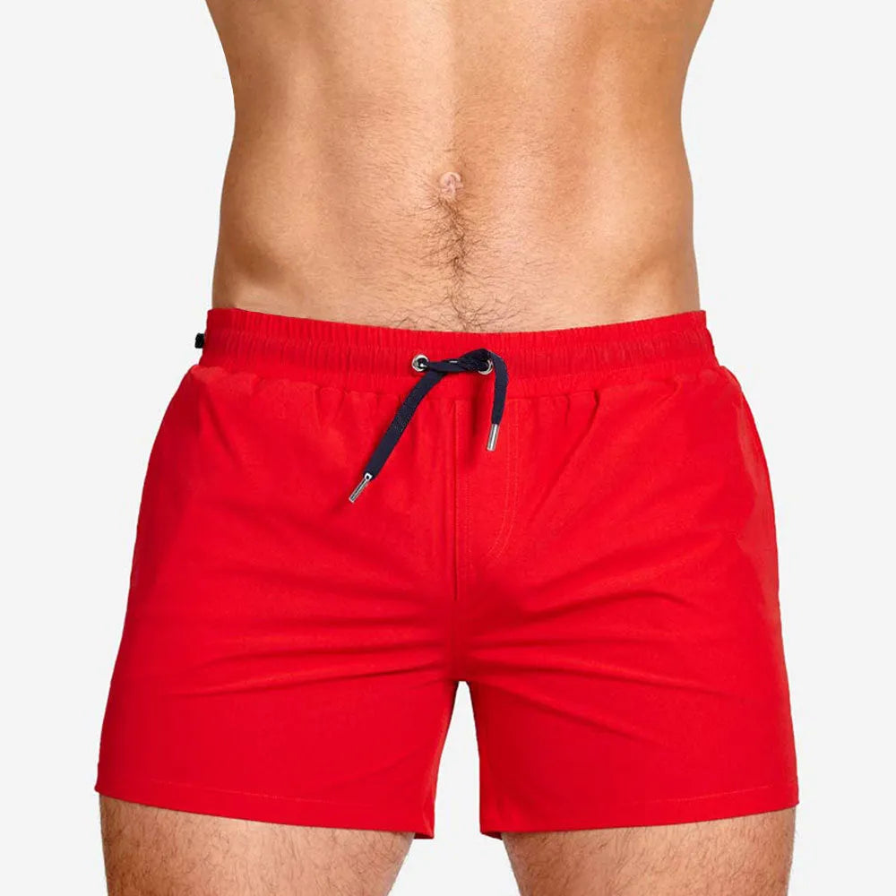 Men's solid colour polyester sports shorts with mesh lining in six colour options
