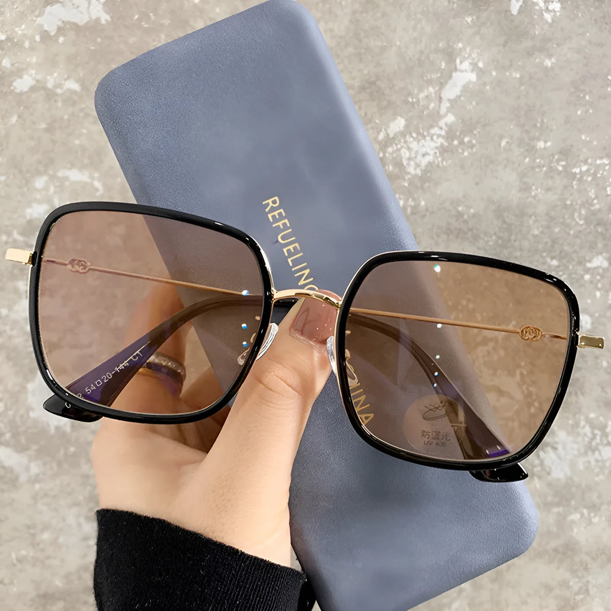 Photochromic myopia glasses with large frame, anti-blue light lens, and Black Gold frame colour options