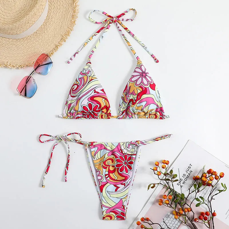 Women's triangle print bikini set with halter neck top and separate bottoms in multicolour pattern