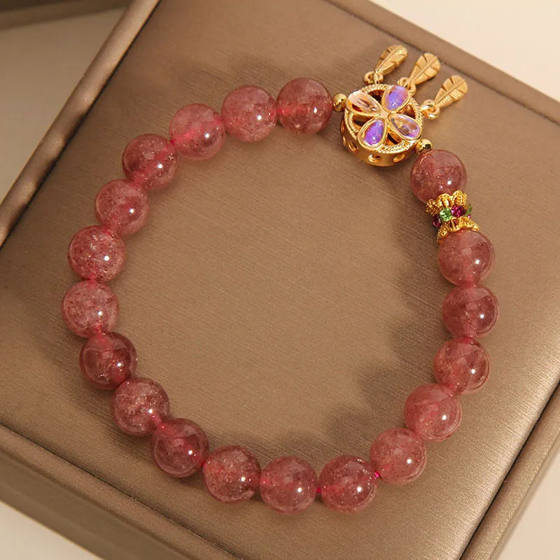 Women's crystal bracelet with strawberry quartz four-leaf dream catcher ball pendant