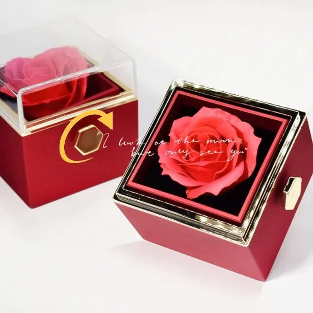 Rotating jewellery gift box with a preserved red rose under a clear acrylic dome.