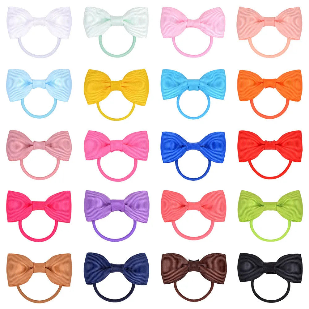 80 piece set of tiny hair ties with grosgrain ribbon bows in 40 colour pairs, size approx 2 inches, on a white background