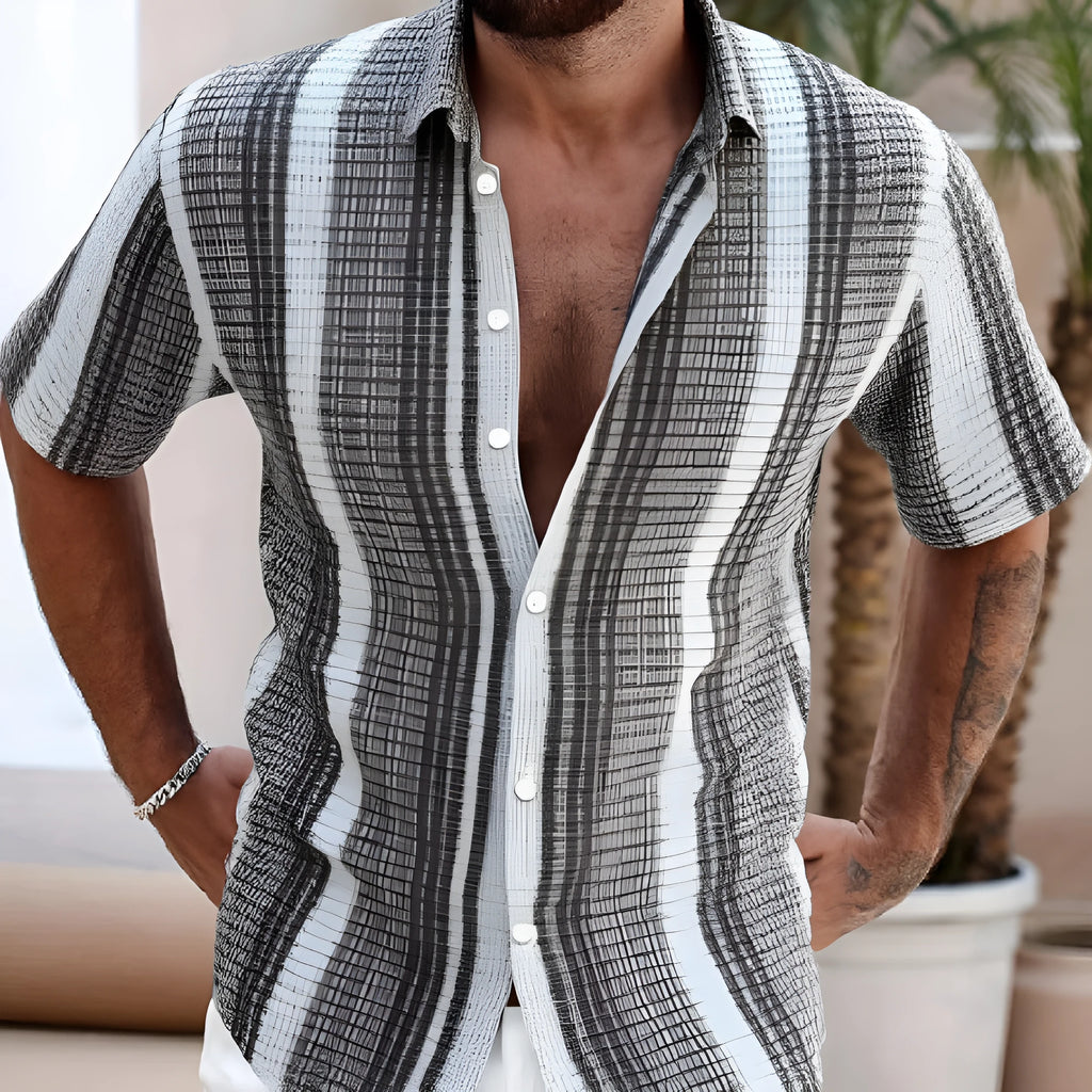 Men's slim fit short sleeve shirt with colourful floral pattern, on a model.