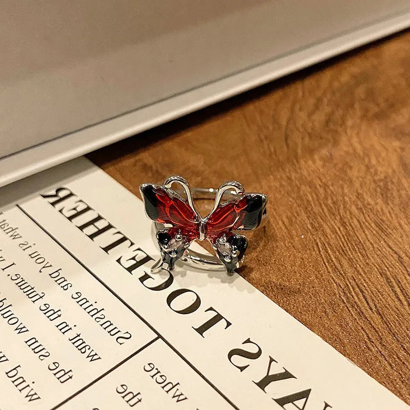 Simple copper women's ring with a Chinese butterfly design, showing an example from the 33 available numbered styles.