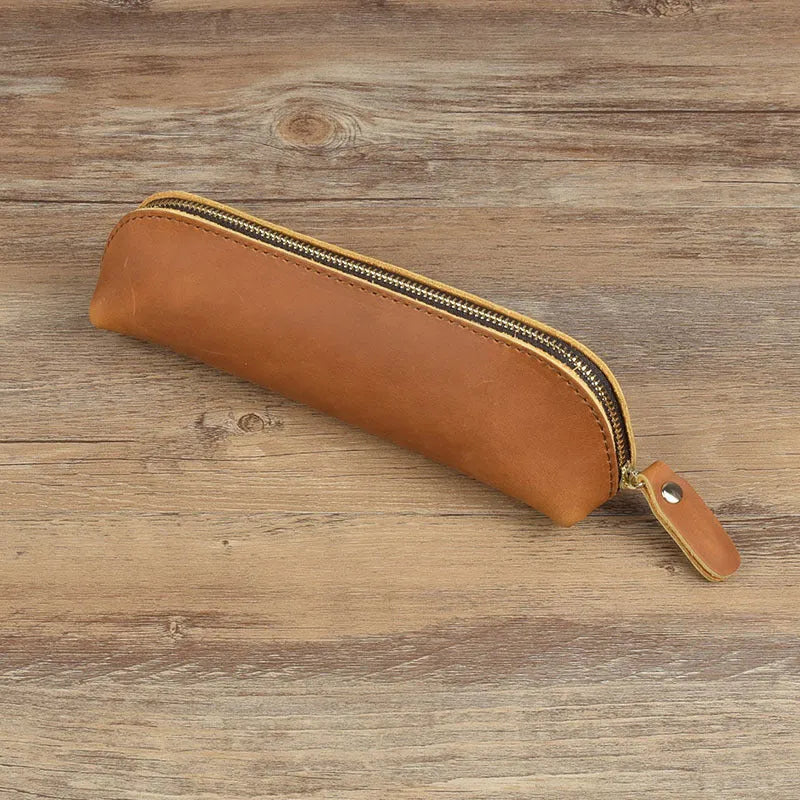 Square handmade genuine cowhide leather pencil case with zipper in black, brown, dark brown, or yellow.