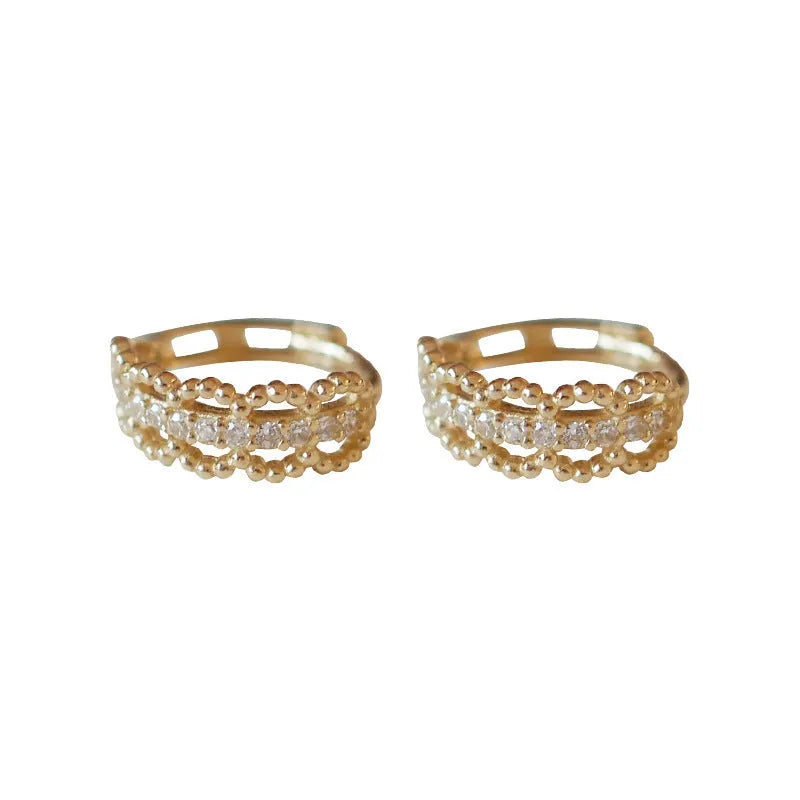 Small lace pattern clip earrings in 925 silver, shown in gold and platinum colour finishes.