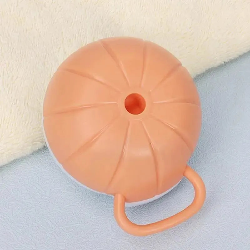 Orange TPR dog shampoo brush with silicone comb teeth and pumpkin-shaped ergonomic handle