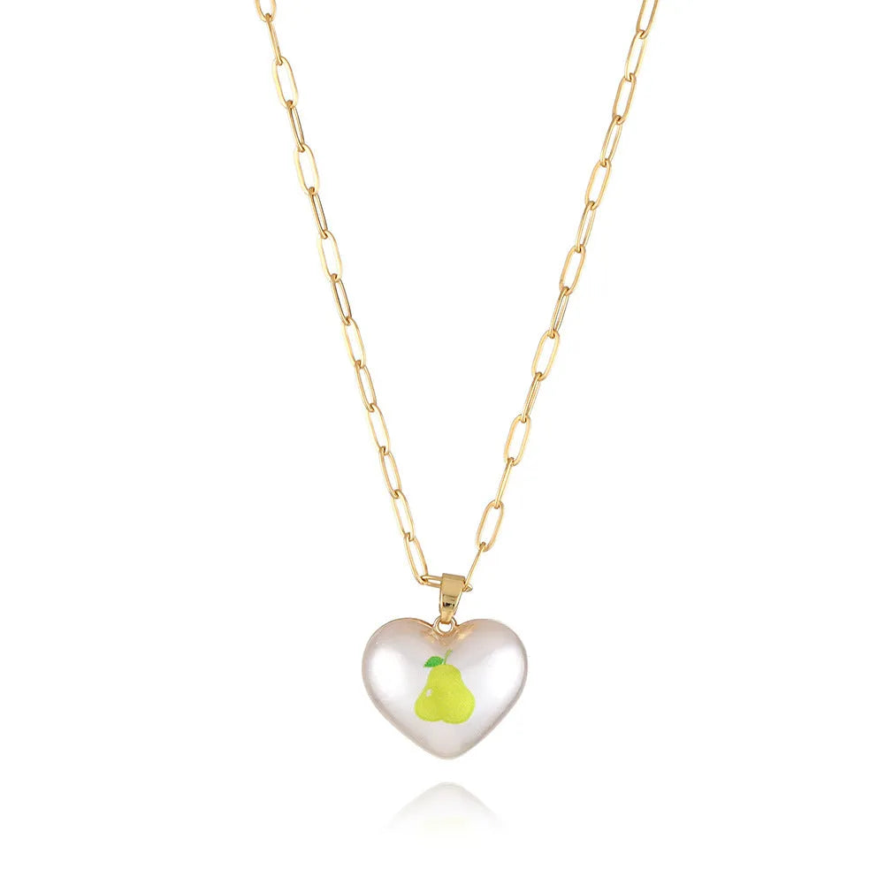 Geometric heart-shaped necklace with a detailed strawberry charm pendant on an adjustable chain.