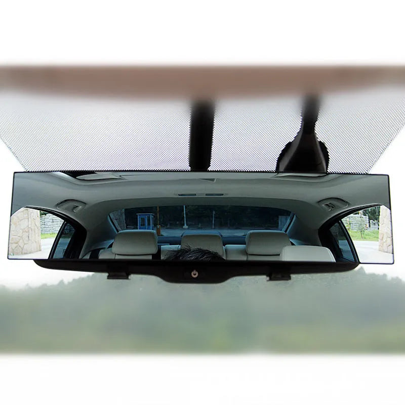 Black interior rearview mirror with double curvature glass, 300mm by 70mm, mounted on car windscreen