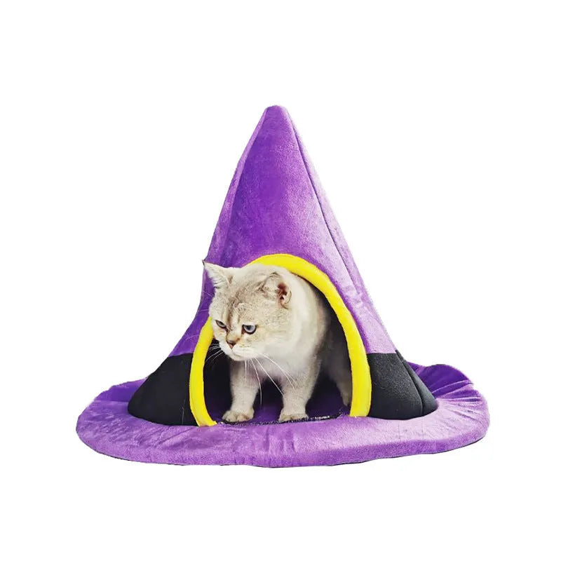 Purple cloth Halloween witch hat shaped cat bed measuring 60 by 45 cm.