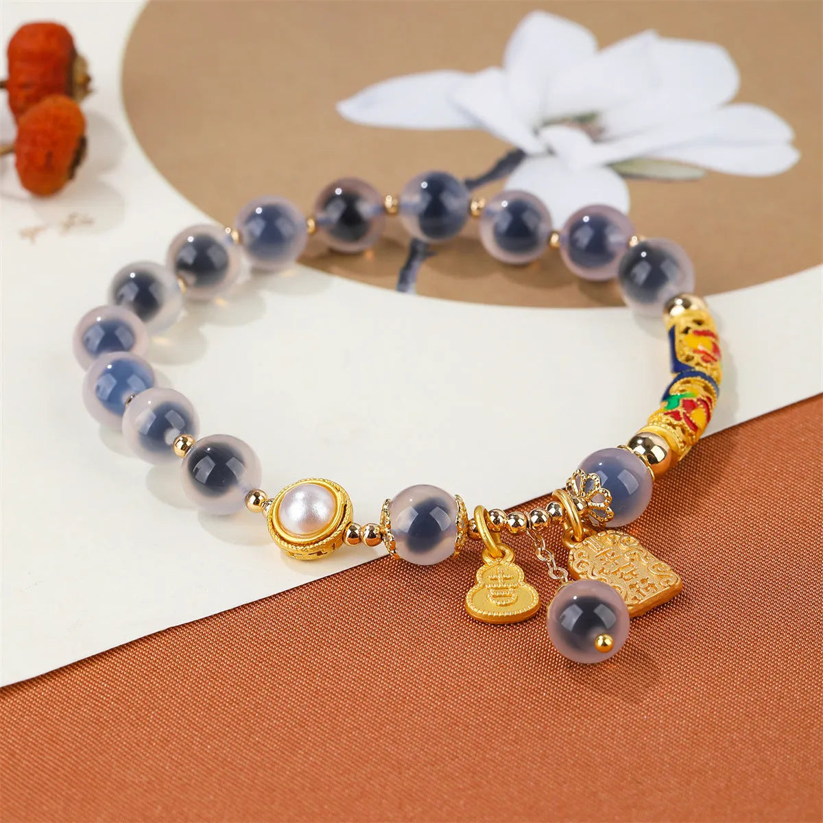 Close-up of a women's sugar heart agate beaded bracelet with an adjustable knot closure on a wrist