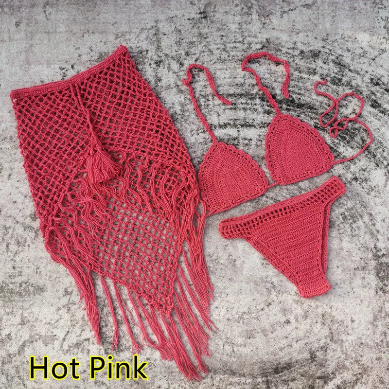 Women's white handmade crochet bikini swimsuit set with a separate matching skirt.