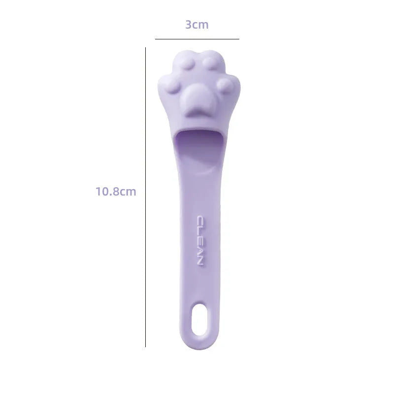 Pink silicone finger cover toothbrush for pets on a white background