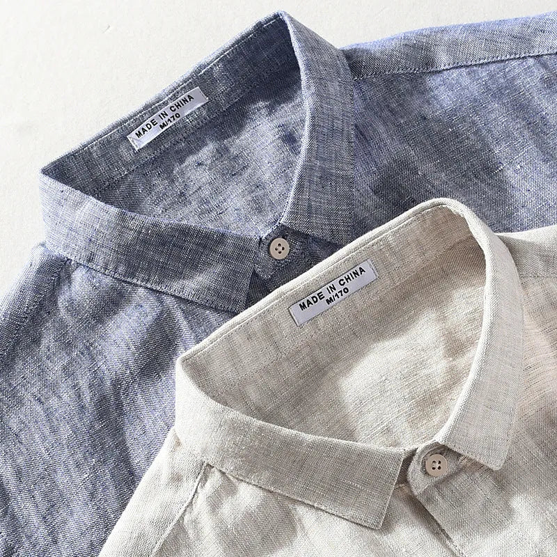 Men's light grey linen short sleeve shirt with a square collar, laid flat.