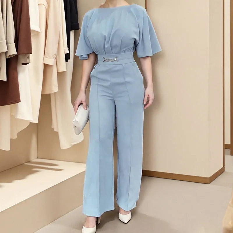 Blue men's two-piece polyester suit on a hanger, showing jacket and trousers.