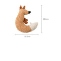 Red fox-shaped and yellow duckling-shaped plush dog toys on a plain background.