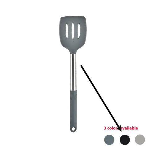 Silicone kitchen utensil set with twelve tools in a rotating white storage caddy on a counter.