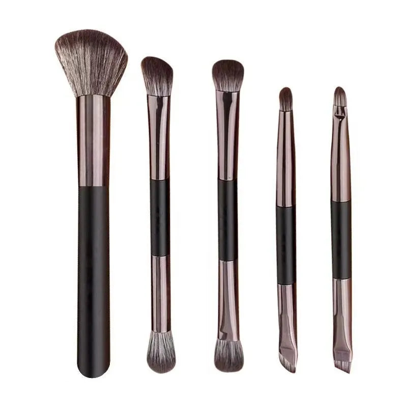 Portable makeup brush set with mirror showing artificial fibre bristles and plastic handles