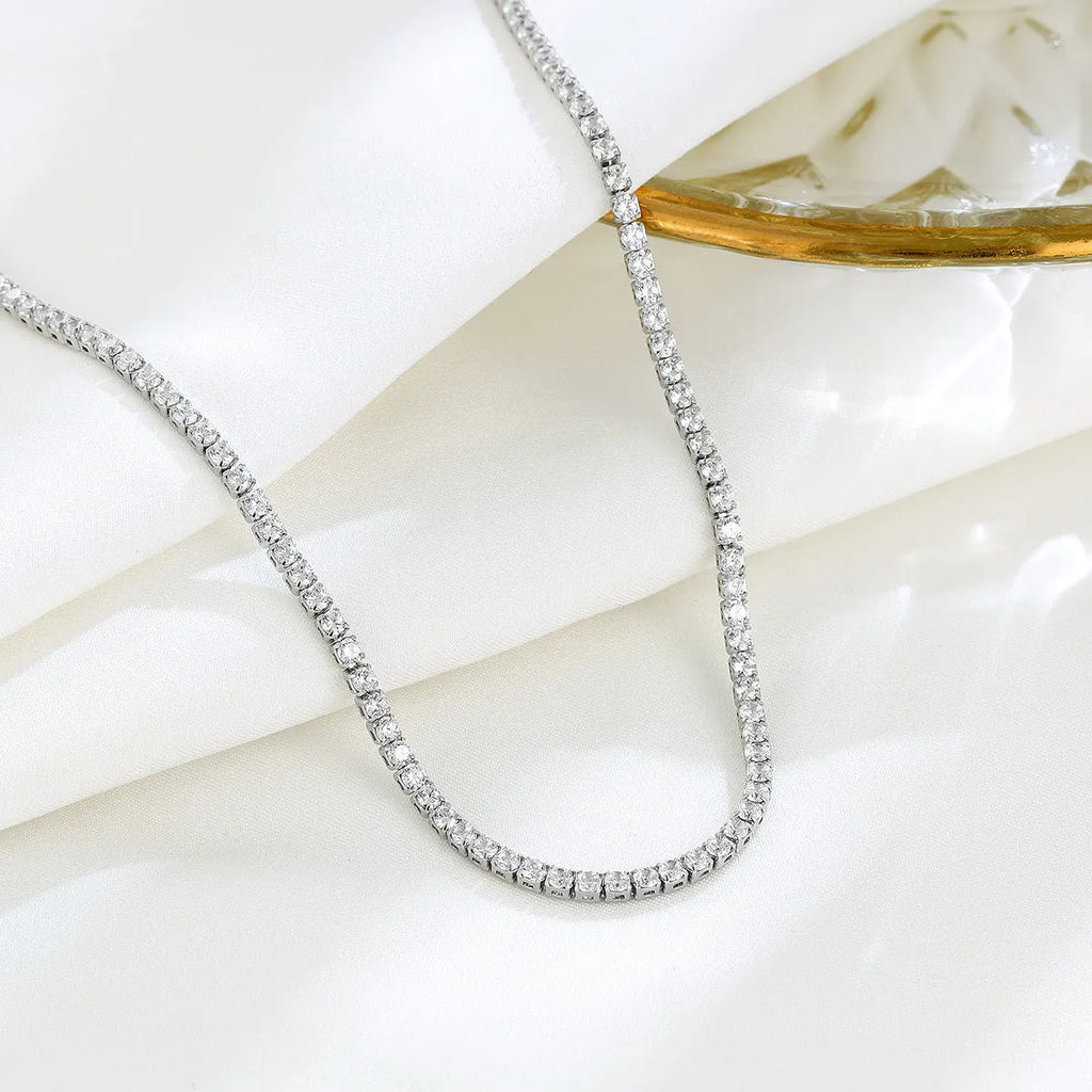 Women's sterling silver necklace with round design and diamond treatment on 925 silver chain