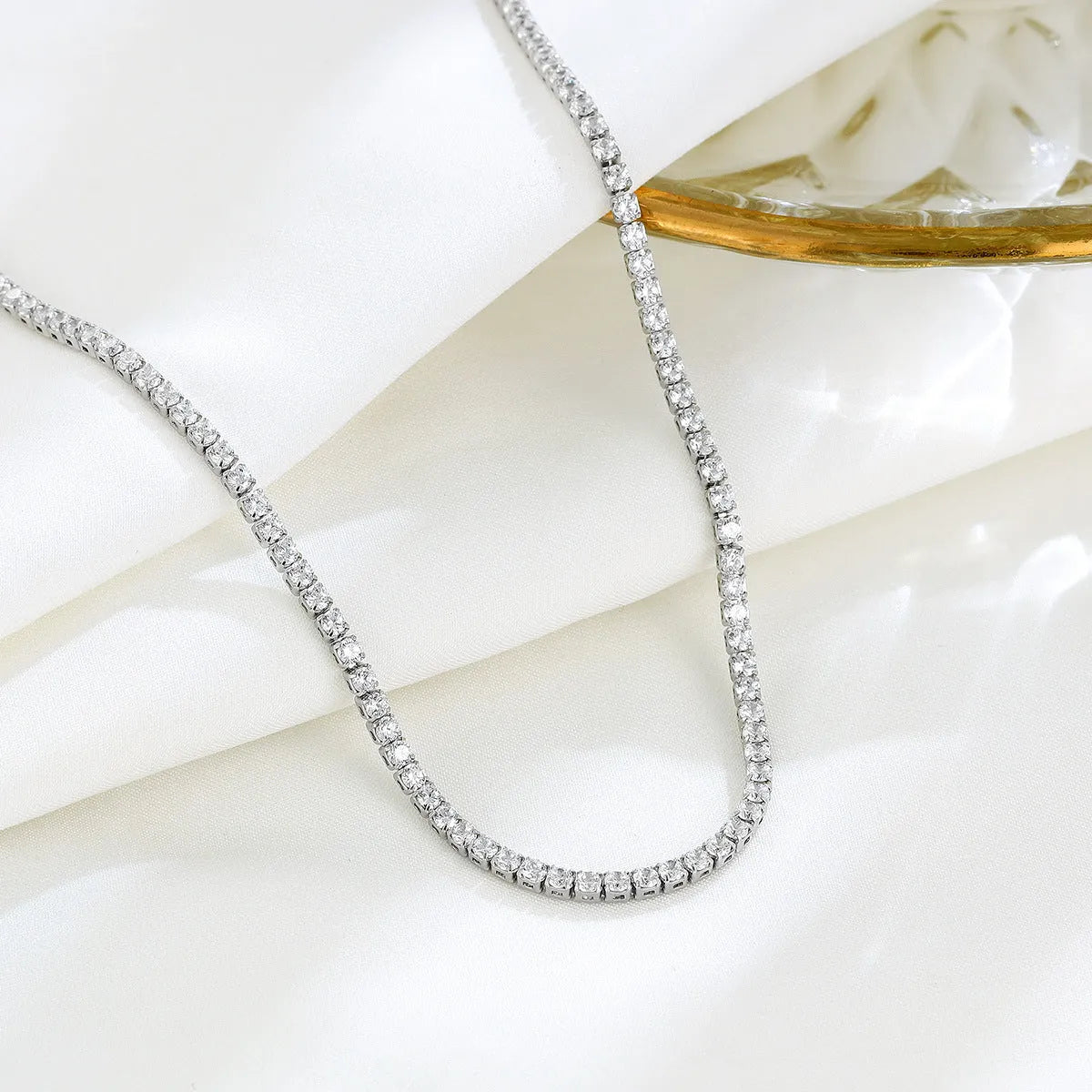 Women's sterling silver necklace with round design and diamond treatment on 925 silver chain