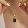 Copper geometric rectangular pendant necklace in XL1006 green on an O-ring chain.