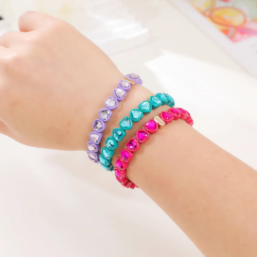 Rainbow enamel alloy heart stretch bracelet showing heart charm with diamond treatment in multiple colour options