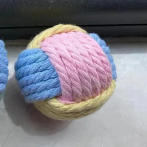 Handmade plush cotton cat hair ball toy in blue powder, green blue, or pink green colours measuring 5cm diameter