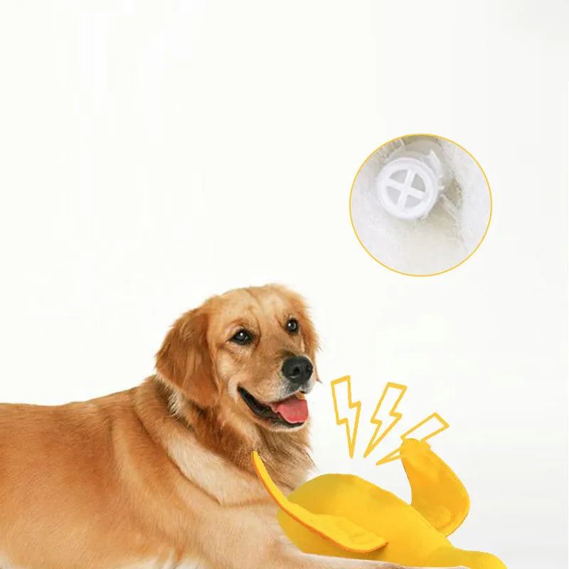 Yellow rubber duck dog toy with squeaker and treat compartment for puppy training and teething.