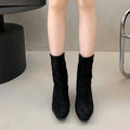 Brown square toe mid-heel ankle boot with side zipper and waterproof platform sole.