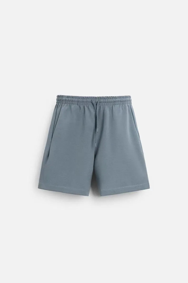 Double-sided cloth texture loose short sleeve top and matching shorts co-ord set on a hanger.