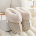 Women's plush winter slippers in various colours with a round toe and non-slip PVC sole.