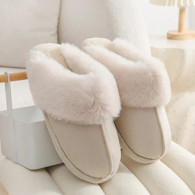 Women's plush winter slippers in various colours with a round toe and non-slip PVC sole.