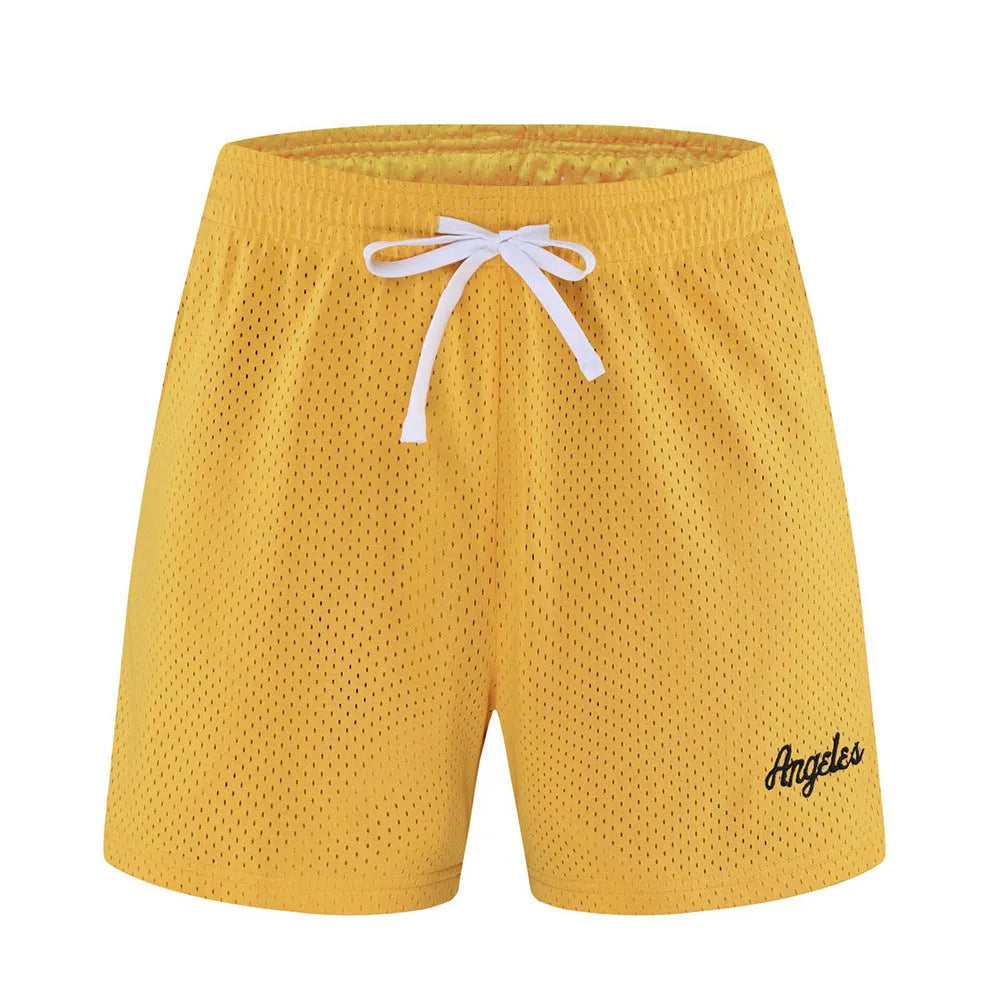 Men's black double-layer mesh shorts laid flat, showing sporty design and mesh fabric texture.