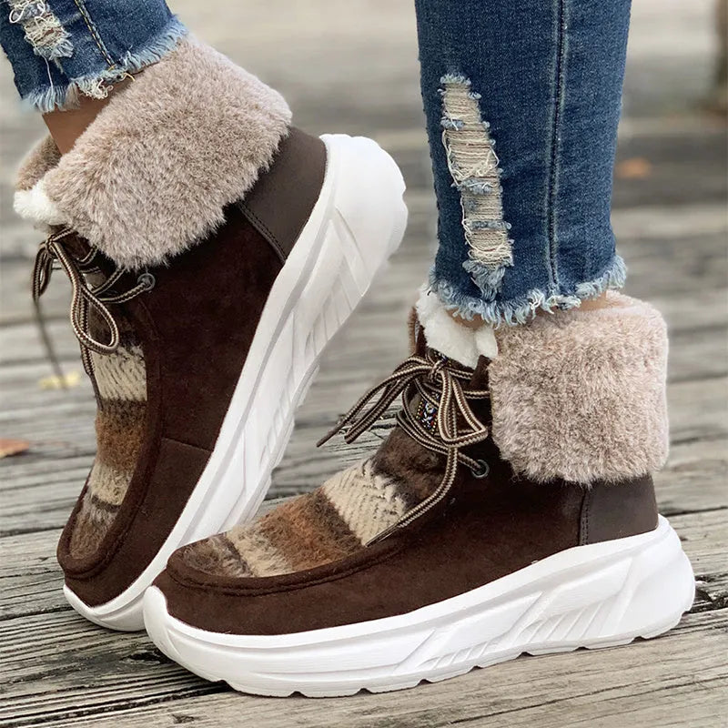 Beige women's lace-up suede snow boots with a thick platform sole and fur lining.