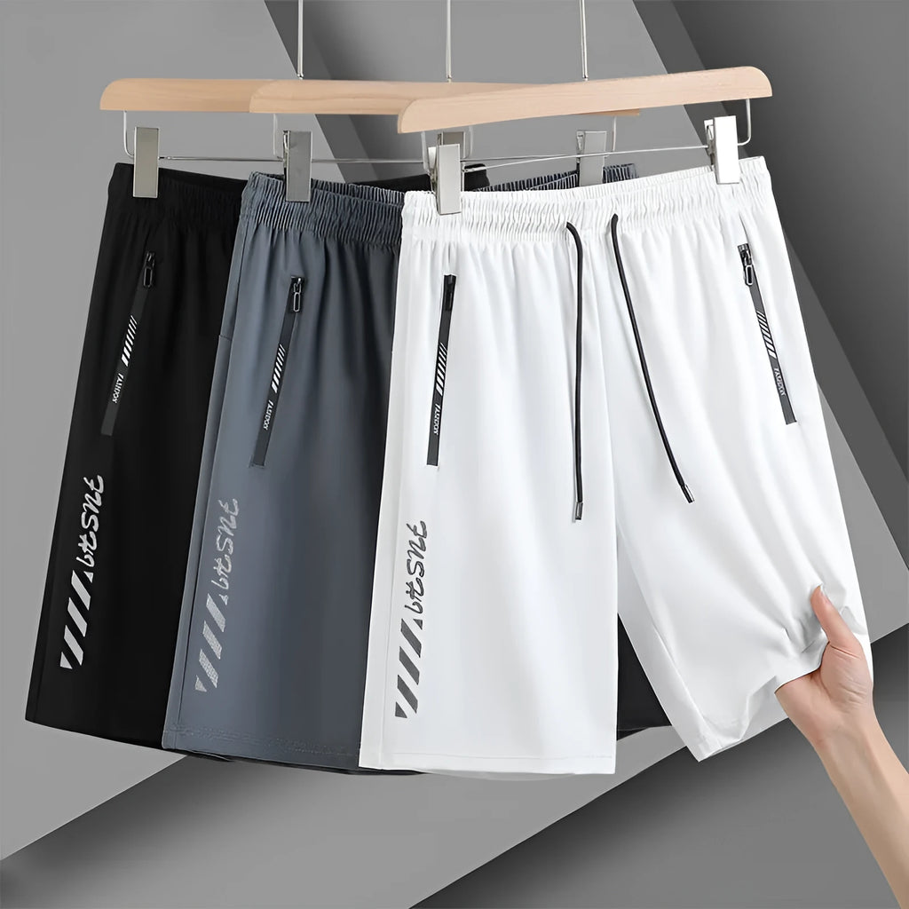 Men's black quick-drying nylon sports shorts in loose fit with fifth pants length