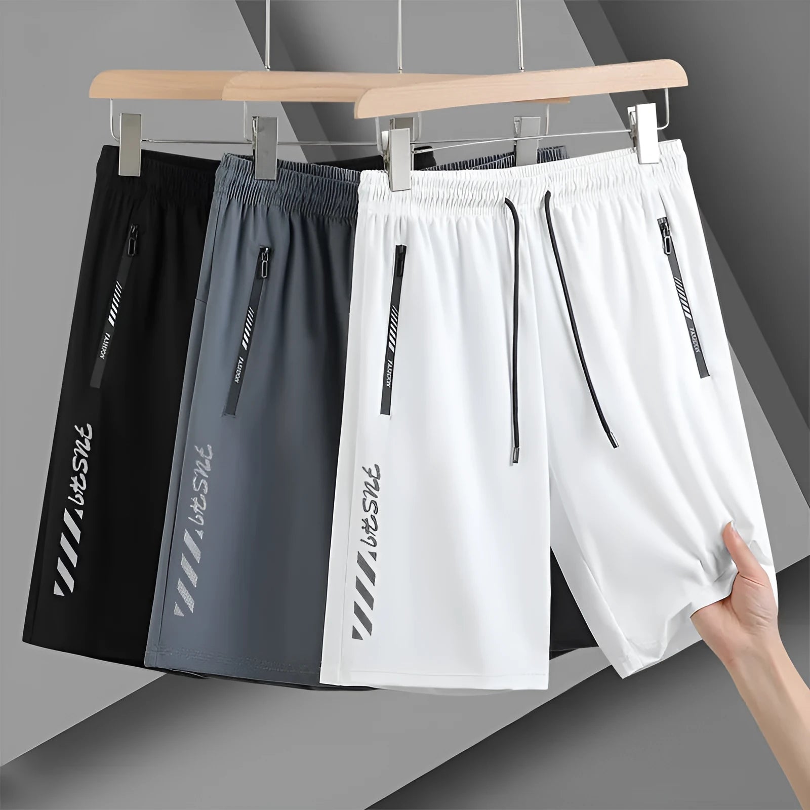 Men's black quick-drying nylon sports shorts in loose fit with fifth pants length