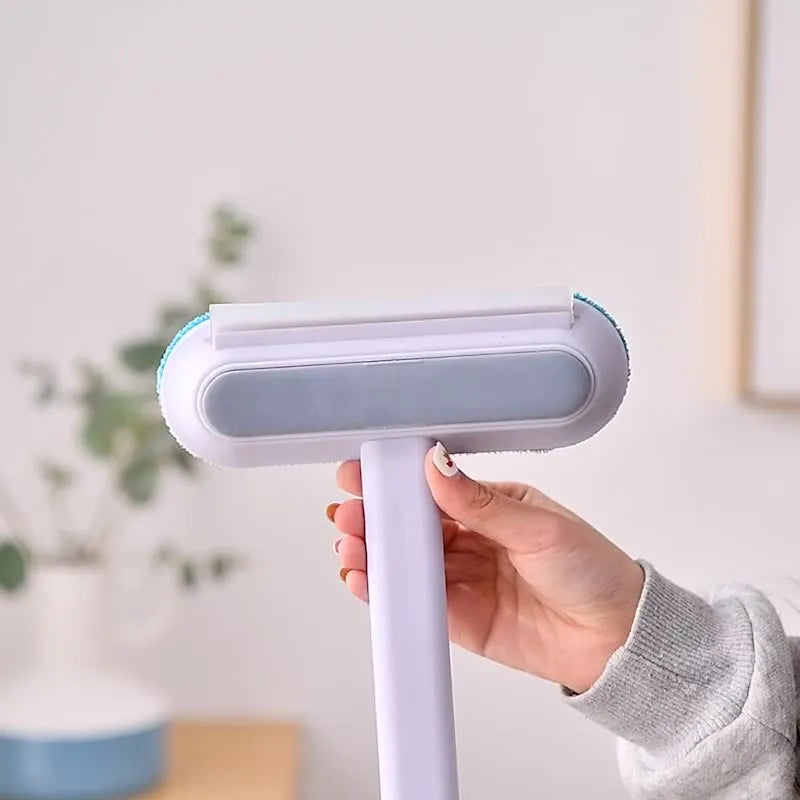 Multifunctional plastic cleaning brush with soft flannel head and extension handle for pet hair and dust.